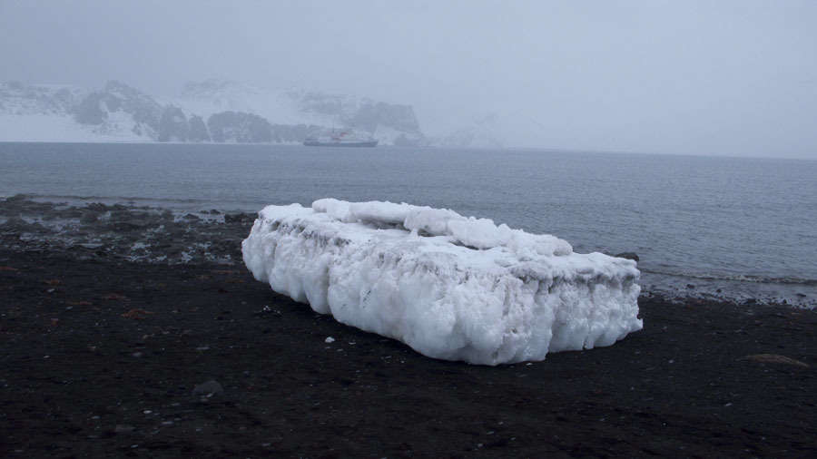 Ice Floe Abandoned on the Volcanic Rock Beach