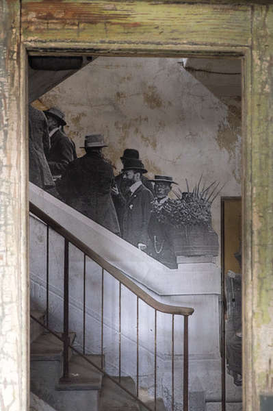JR Photographs Along Stairway inside Ellis Island Hospital